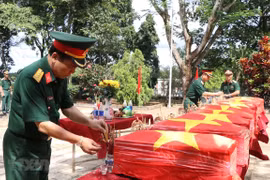 Remains of 10 martyrs reburied in Dak Nong 