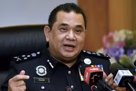 Malaysia detains two network attack suspects