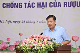 Official urges stronger actions against alcohol harms