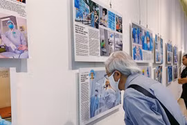 Photo exhibition reveals untold stories of COVID-19 fighters