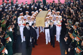 Party General Secretary Nguyen Phu Trong's casket leaves National Funeral Hall (Photo: VNA)