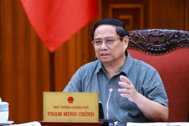 Prime Minister Pham Minh Chinh chairs a meeting between permanent cabinet members and the standing board of the sub-committee for socio-economic affairs of the 14th National Party Congress on September 9. (Photo: VNA)