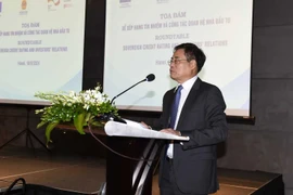 Truong Hung Long, Director of the Department of Debt Management and External Finance under the Ministry of Finance, speaks at the seminar. (Photo: mof.gov.vn)