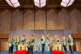 The sake barrel breaking ceremony to inaugurate CMC's third office in Japan. (Photo: VNA)