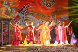 "Ao dai" show at the festival. (Photo: VNA)