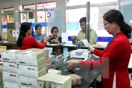 Reference exchange rate down 3 VND
