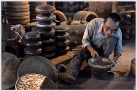 Phuoc Kieu villagers keep forge fires burning