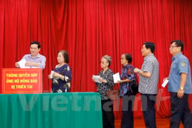 Overseas Vietnamese in Laos help disaster victims