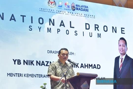 Malaysian Minister of Natural Resources and Environmental Sustainability Nik Nazmi Nik Ahmad speaks at the symposium. (Photo: Bernama)