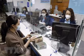 Reference exchange rate down 1 VND on December 8