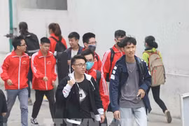 Universities plan to receive students for in-person learning after Tet
