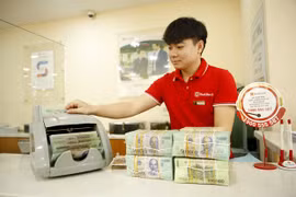 Reference exchange rate down 3 VND