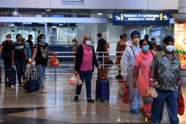 Malaysia shortens quarantine period for travellers with booster shots