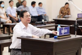 Ex-minister of industry and trade has jail term reduced by one year