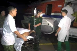 Helicopter brings injured fisherman ashore for treatment