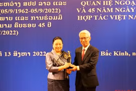 Vietnamese, Lao embassies in China hold friendship exchange