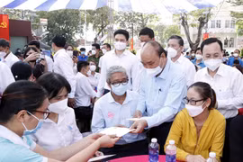 President pays Tet visit to HCM City workers