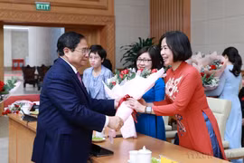 Vietnamese women affirm role and position in social development