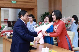 Vietnamese women affirm role and position in social development