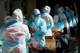 Thailand sees new daily record of COVID-19 deaths, Singapore probing re-infections