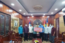 Laos joins hands with Vietnam to fight COVID-19