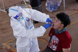 Laos sees hikes in community COVID-19 infections 