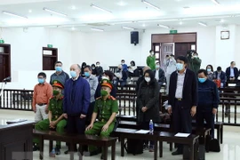 TISCO-related case: jail terms reduced for three defendants