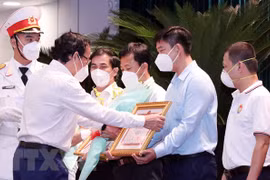 Collectives, individuals honoured for supporting COVID-19 fight in HCM City