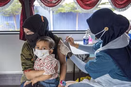 Malaysia starts vaccination rollout for adolescents