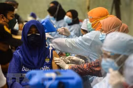 Indonesia continues to extend restrictions on community activities