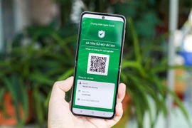 HCM City to pilot COVID-19 green cards in three districts