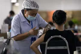 Laos rolls out measures to curb COVID-19 spread in community