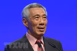 Singaporean PM affirms policy to stay open