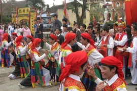 Men dress up gracefully to perform dance at village festival