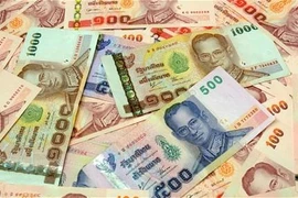 Piles of Thai currency (Source:Telegraph.com)