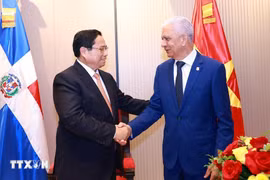 PM Pham Minh Chinh (L) and President of the Dominican Republic’s Senate Ricardo de los Santos Polanco. (Photo: VNA)