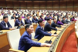 NA deputies vote to approve a resolution on the establishment of centrally-run Hue city (Photo: VNA)