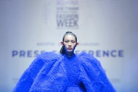 Huynh Tu Anh, winner of The Face Vietnam 2023, in a creation by designer Do Manh Cuong, who will open the AVIFW Fall/Winter 2024 with the collection called 'Giot Nuoc Thuan Khiet' (Pure Water Drop). (Photo courtesy of Multimedia JSC)