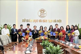 The Hanoi Department of Education and Training holds a meeting on November 27 with local outstanding students who will represent Vietnam at the International Junior Science Olympiad (IJSO) 2024. (Photo: VNA)