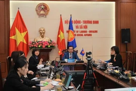 Deputy Minister of Labour, Invalids and Social Affairs Nguyen Ba Hoan (centre) shares about the implementation of commitments on gender mainstreaming and women's empowerment in Vietnam. (Photo: VietnamPlus)