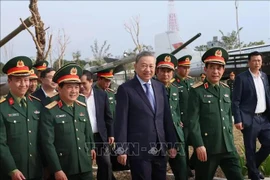 Party General Secretary To Lam (centre), who is also Secretary of the Central Military Commission, visits the Vietnam Military History Museum in Hanoi on December 3 (Photo: VNA)