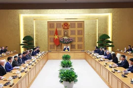 Prime Minister Pham Minh Chinh receives a delegation of aerospace, defence and security companies under the US-ASEAN Business Council (USABC) in Hanoi on December 18. (Photo: VNA)