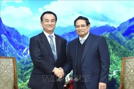 PM Pham Minh Chinh (R) and Yamaguchi Governor Muraoka Tsugumasa (Photo: VNA)