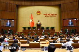 Participants at the seventh working day of 15th NA’s eighth session. (Photo: VNA)