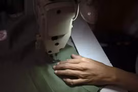  A worker works on a piece of clothing at a small-scale manufacturing in South Jakarta on September 30. (Photo: Antara)