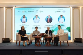 A panel discussion as part of the “Green Innovation in Factories and Industrial Parks: Going with the Flow for Sustainable Development” seminar in HCM City on August 8. (Photo courtesy of ITPC)