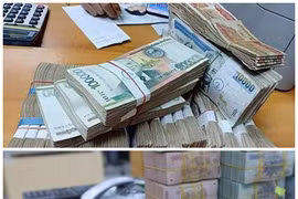 Vietnamese, Lao central banks discuss cooperation in using local currencies in bilateral trade