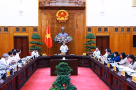 Prime Minister Pham Minh Chinh speaks at the meeting in Hanoi on August 14. (Photo: VNA)