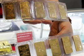 Bao Tin Minh Chau gold bars are displayed for sale in Hanoi. (Photo: VNA)