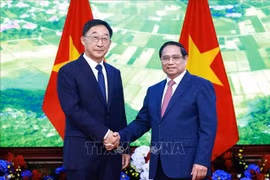 PM Pham Minh Chinh (right) welcomes Liu Ning, Secretary of the CPC Committee of China’s Guangxi Zhuang Autonomous Region, in Hanoi on August 28. (Photo: VNA)